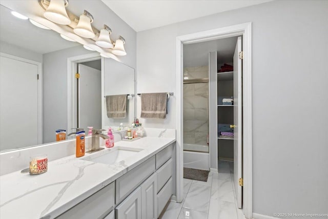 bathroom featuring shower / bath combination, vanity, and marble finish floor