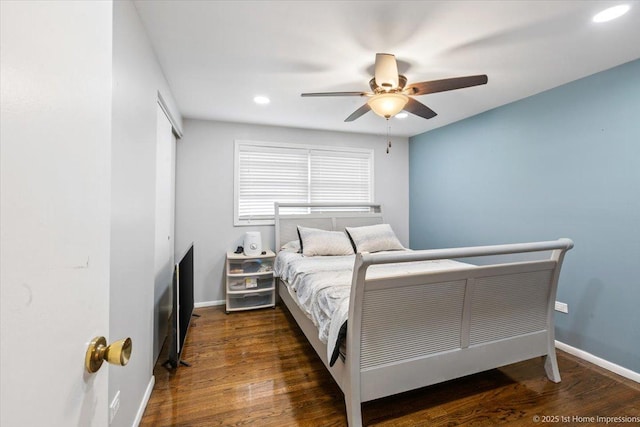 bedroom featuring ceiling fan, recessed lighting, baseboards, wood finished floors, and a closet