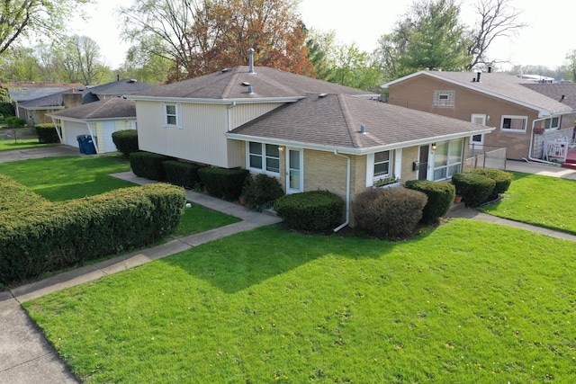 view of front of property featuring brick siding, a front lawn, roof with shingles, and a garage