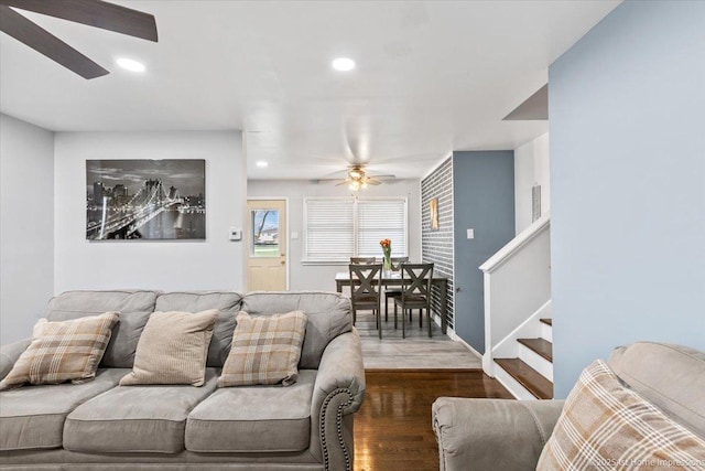 living room with recessed lighting, a ceiling fan, stairs, and dark wood-type flooring