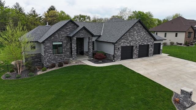 4432 Bryant Dr, Quincy, IL 62305 - view of front facade featuring a front yard, driveway, stone siding, roof with shingles, and an attached garage