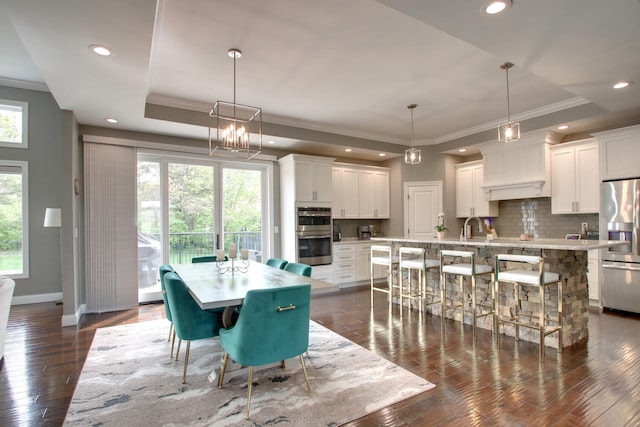 4432 Bryant Dr, Quincy, IL 62305 - dining area with ornamental molding, dark wood finished floors, and baseboards