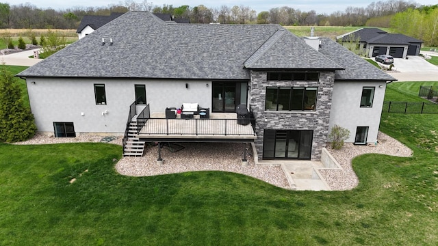 4432 Bryant Dr, Quincy, IL 62305 - back of house featuring a deck, stucco siding, and roof with shingles