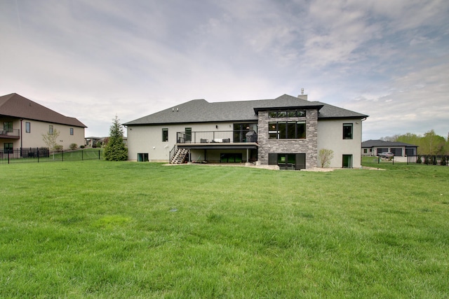 4432 Bryant Dr, Quincy, IL 62305 - back of property with a wooden deck, a chimney, a lawn, fence, and stairway