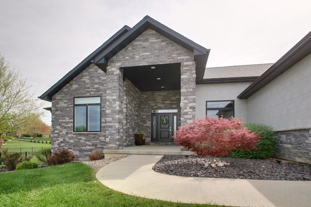 4432 Bryant Dr, Quincy, IL 62305 - property entrance featuring fence, a yard, and stone siding