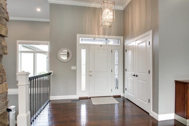 4432 Bryant Dr, Quincy, IL 62305 - foyer featuring dark wood finished floors, baseboards, ornamental molding, and a high ceiling