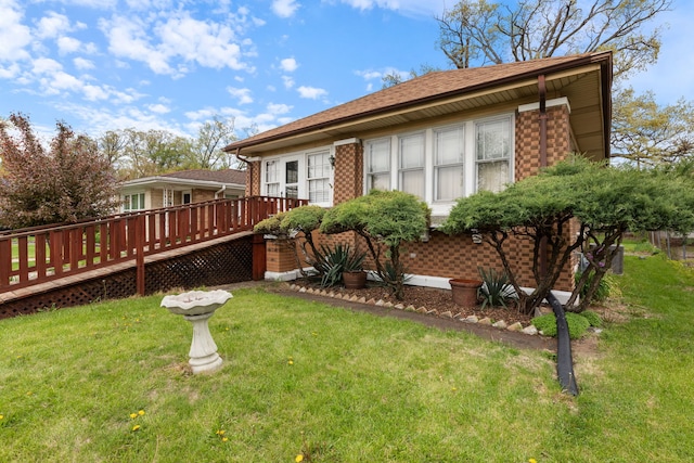 420 N Hebbard St, Joliet, IL 60432 - rear view of property with a deck, a yard, and brick siding
