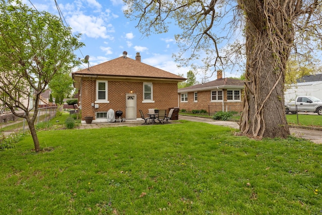 420 N Hebbard St, Joliet, IL 60432 - back of property with brick siding and a patio area