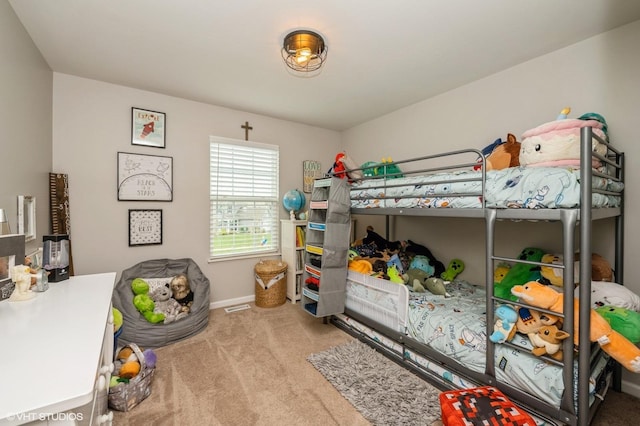 carpeted bedroom featuring baseboards