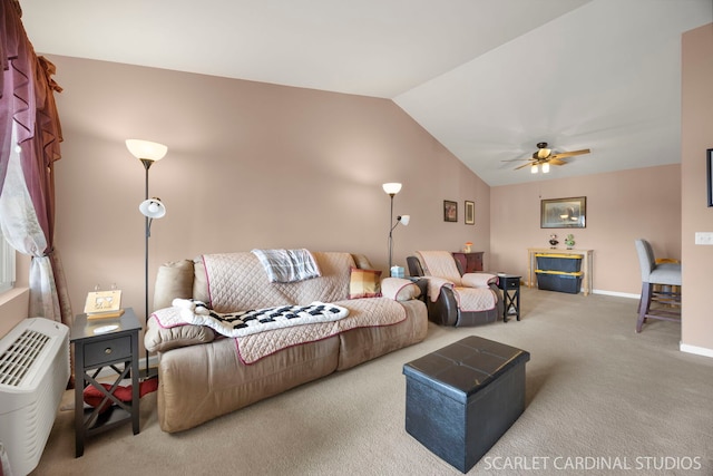 carpeted living area with ceiling fan, baseboards, and lofted ceiling