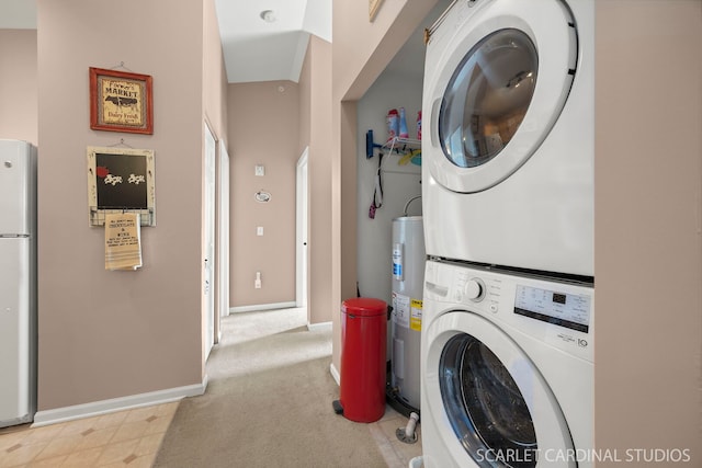 laundry area with laundry area, stacked washer and dryer, baseboards, carpet flooring, and water heater