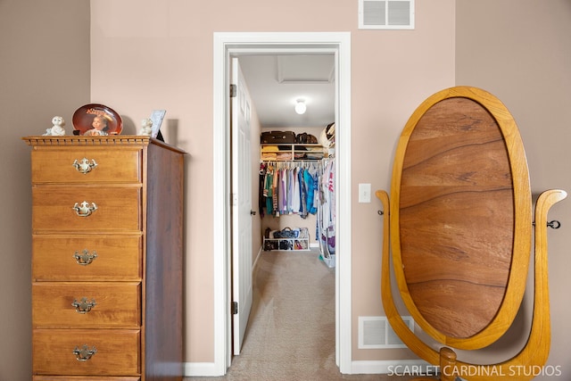 interior space featuring attic access, carpet flooring, and visible vents