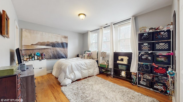 bedroom featuring light wood finished floors