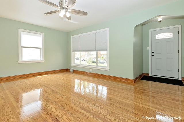 entryway featuring visible vents, baseboards, wood finished floors, and a healthy amount of sunlight
