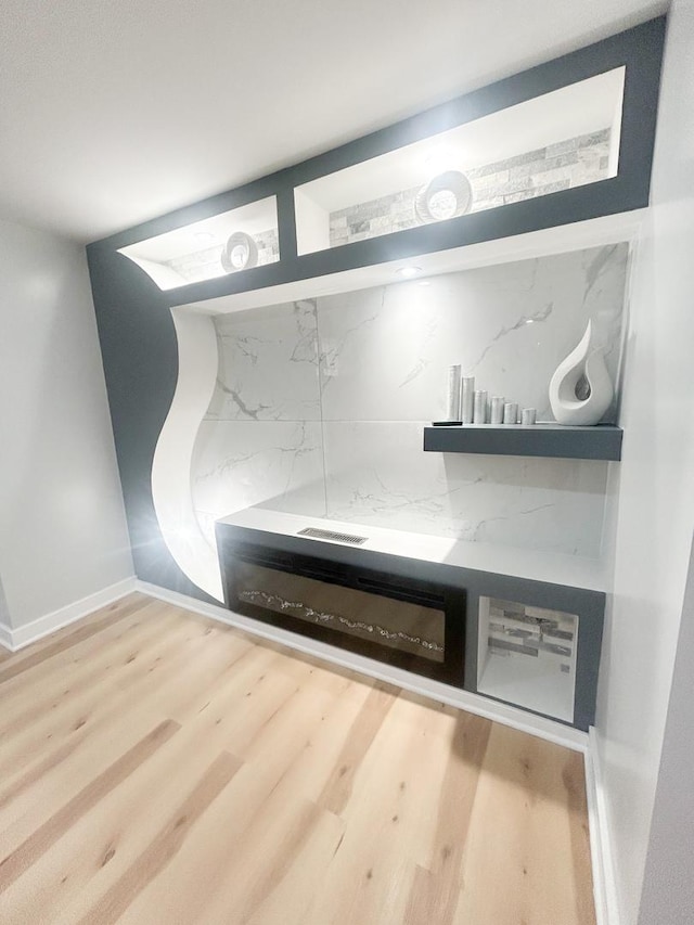 room details featuring wood finished floors and baseboards