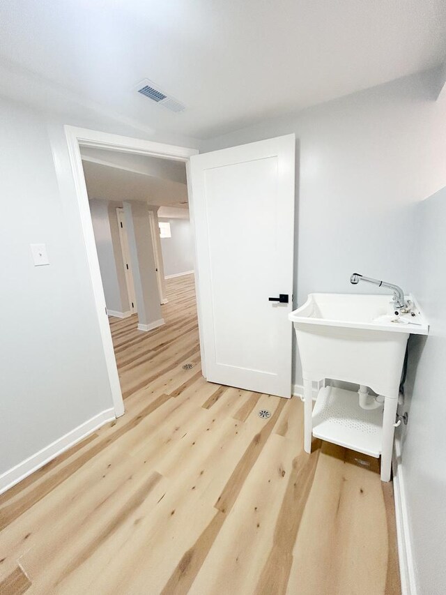 stairway featuring wood finished floors and baseboards