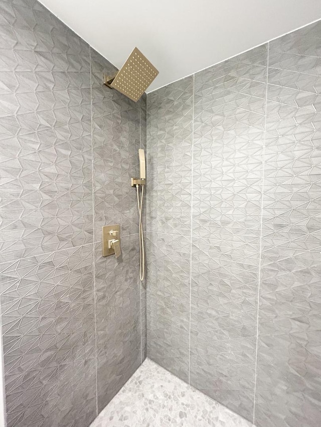 bathroom with tiled shower