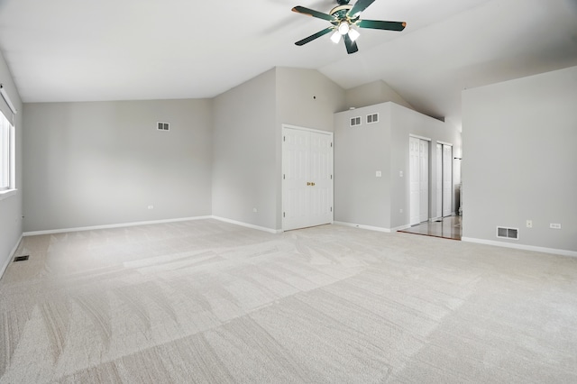 122 Periwinkle Ln, Bolingbrook, IL 60490 - unfurnished living room with vaulted ceiling, ceiling fan, light colored carpet, and baseboards