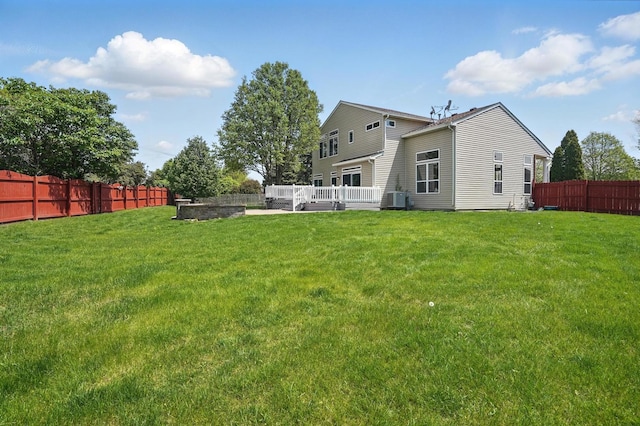 122 Periwinkle Ln, Bolingbrook, IL 60490 - back of property with central AC and a deck