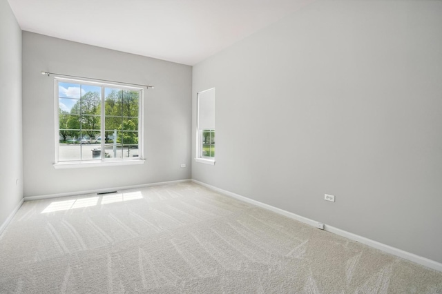 122 Periwinkle Ln, Bolingbrook, IL 60490 - spare room with carpet floors, healthy amount of natural light, and baseboards