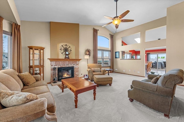 living area with carpet flooring, a fireplace, ceiling fan, lofted ceiling, and baseboards