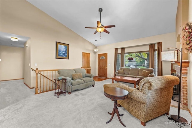 living room with carpet, baseboards, a ceiling fan, and high vaulted ceiling
