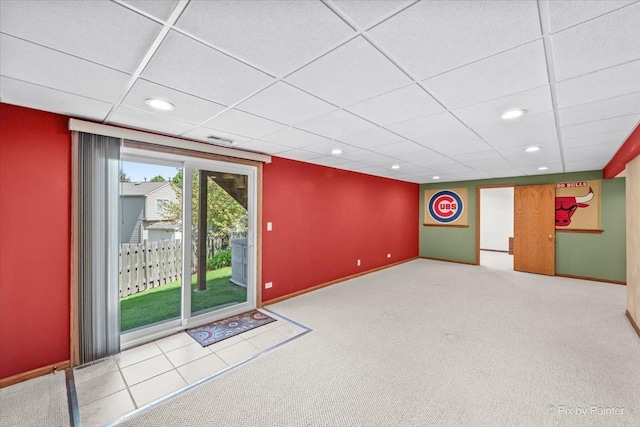 below grade area with recessed lighting, a drop ceiling, baseboards, and carpet floors