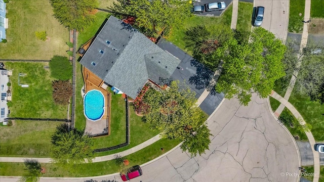 aerial view of property and surrounding area with a pool area