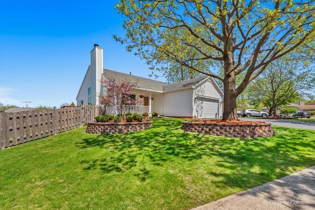 ranch-style home with an attached garage and asphalt driveway