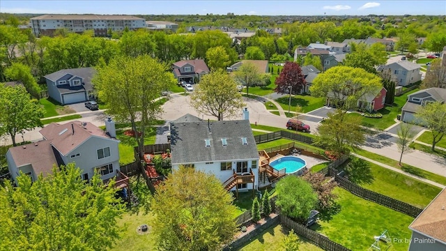 aerial perspective of suburban area with a pool