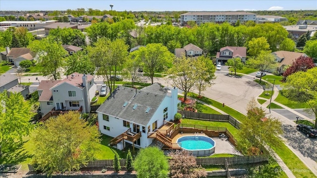 aerial perspective of suburban area featuring a pool area