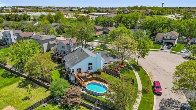 aerial perspective of suburban area featuring a pool area
