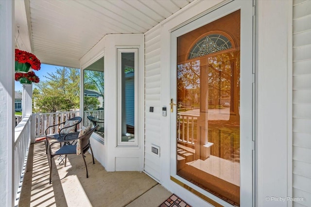 doorway to property featuring covered porch
