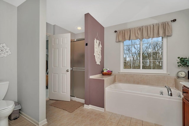 bathroom featuring a garden tub, tile patterned flooring, toilet, baseboards, and a stall shower