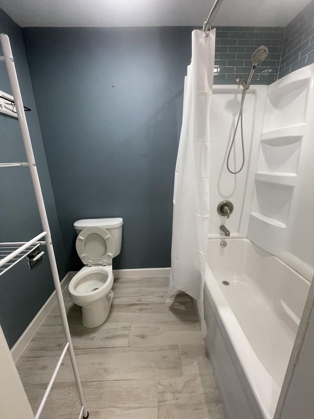 2008 Jamestown Dr Unit 0, Palatine, IL 60074 - bathroom featuring shower / bath combination with curtain, toilet, and baseboards