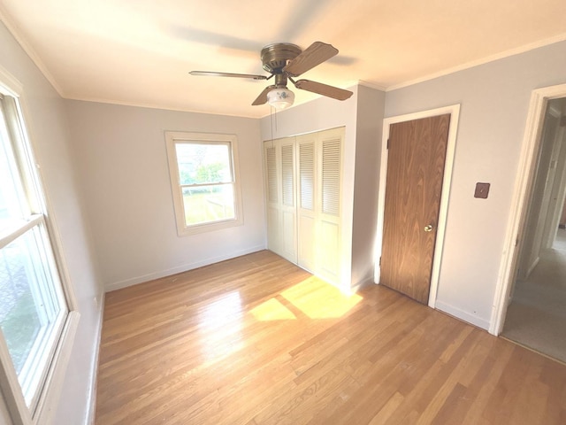 5404 Kimball Pl, Oak Lawn, IL 60453 - unfurnished bedroom featuring light wood-style flooring, a closet, baseboards, ornamental molding, and ceiling fan