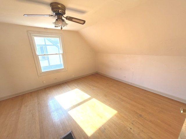 5404 Kimball Pl, Oak Lawn, IL 60453 - additional living space featuring light wood-style flooring, vaulted ceiling, and baseboards