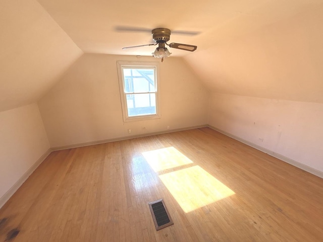 5404 Kimball Pl, Oak Lawn, IL 60453 - additional living space featuring light wood-type flooring, lofted ceiling, and baseboards