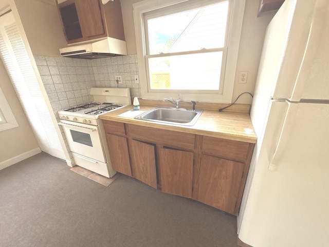 5404 Kimball Pl, Oak Lawn, IL 60453 - kitchen with white appliances, a sink, under cabinet range hood, light countertops, and backsplash