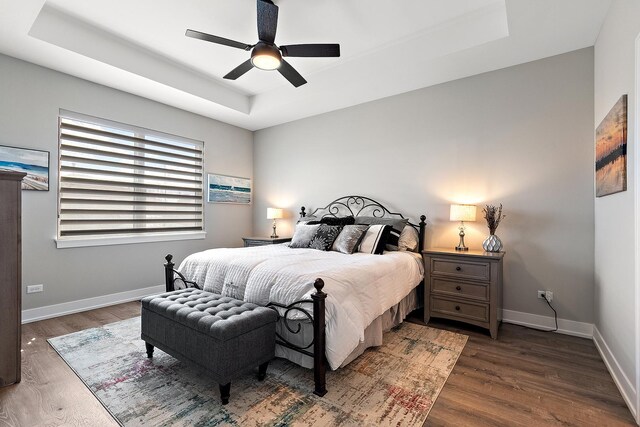 1340 Lacoma Ct, Lockport, IL 60441 - bedroom with baseboards, a tray ceiling, ceiling fan, and wood finished floors