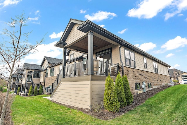 1340 Lacoma Ct, Lockport, IL 60441 - view of home's exterior featuring a yard, brick siding, a residential view, and stairs