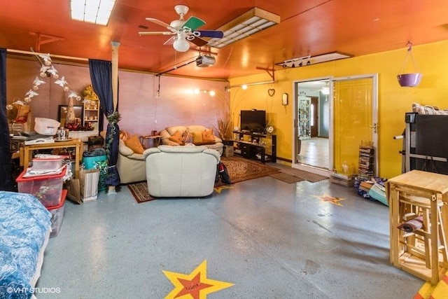 living room featuring a ceiling fan