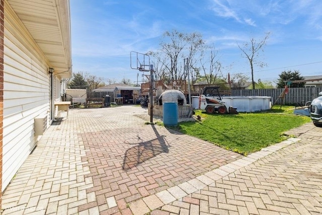 view of patio featuring a fenced in pool and a fenced backyard