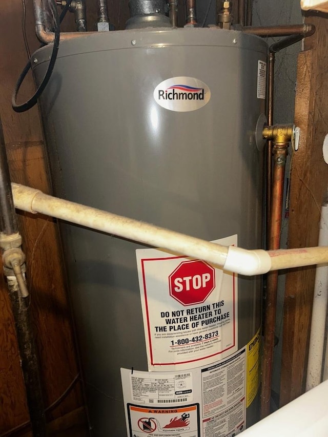 utility room with water heater