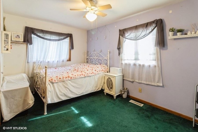 bedroom with visible vents, a ceiling fan, carpet flooring, and baseboards