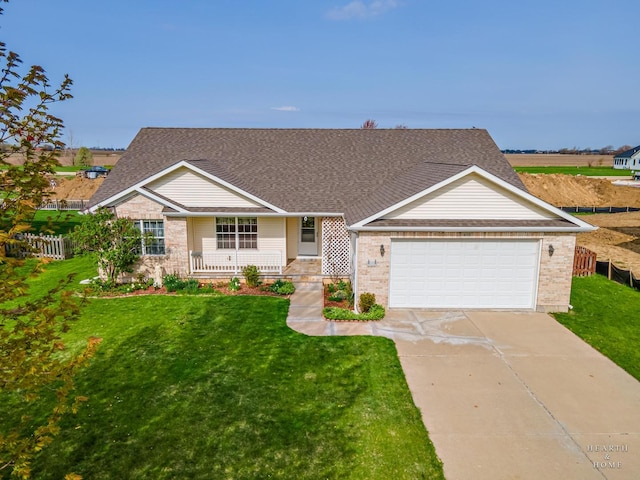 ranch-style house with fence, an attached garage, a porch, a front yard, and driveway