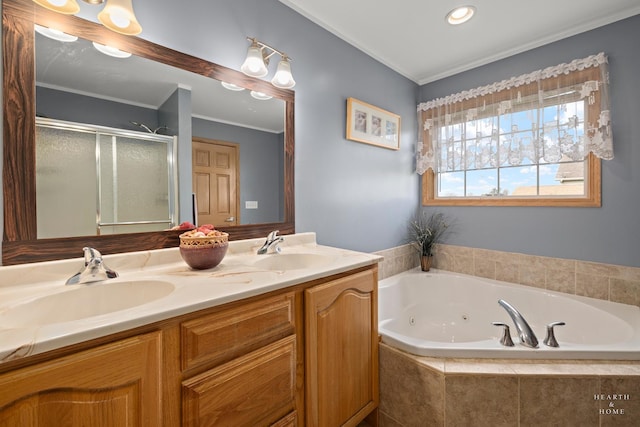bathroom with crown molding, a tub with jets, a shower stall, and a sink