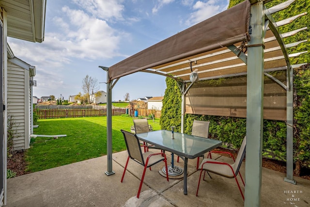 view of patio / terrace featuring a pergola, fence, outdoor dining space, and a playground