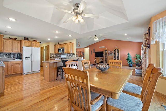 dining room featuring recessed lighting, a ceiling fan, light wood finished floors, and lofted ceiling