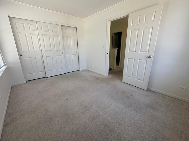414 E Victoria Cir Unit 414, North Aurora, IL 60542 - unfurnished bedroom with baseboards, ornamental molding, carpet, and a closet